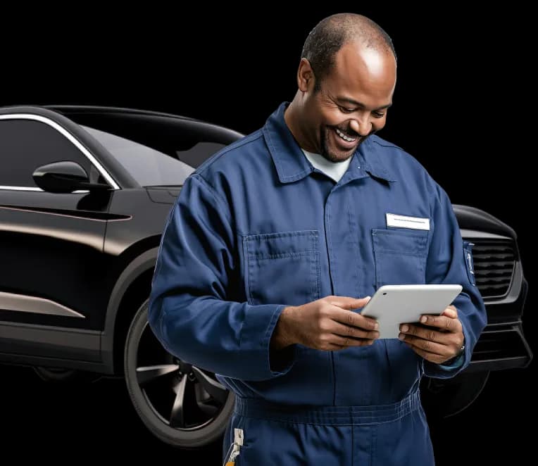 Certified inspector reviewing a vehicle with a tablet